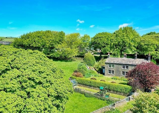 Enclosed lawned gardens include patio seating areas.