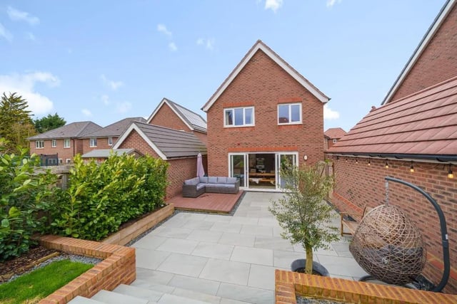 One of the standout features of this property is the stunning garden, which has been beautifully landscaped to create a gorgeous outdoor space. The patio area is perfect for entertaining or to relax in summer, with steps leading up to the lawn area.