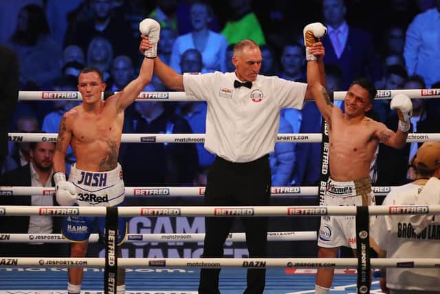 LEEDS, ENGLAND - SEPTEMBER 04: Mauricio Lara and Josh Warrington react to a technical draw after the Featherweight fight between Mauricio Lara and Josh Warrington at Emerald Headingley Stadium on September 04, 2021 in Leeds, England. (Photo by George Wood/Getty Images)