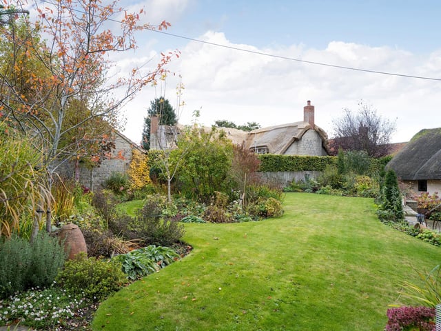 Stunning landscaped gardens include seating areas , ideal for al fresco dining in the summer.