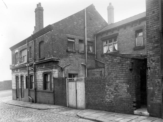 The Tulip Inn as seen from Princess Row. This Hammonds Ales pub fronts onto Dolly Lane. The landlord was Clifford Cracknell and the address was 42 Dolly Lane. At this side are gates to a yard where deliveries would be made. The inn had storage cellars or vaults where the kegs of ale could be kept. Far right is the access to toilets for the back to back houses on Primrose Row. Pictured in August 1958.