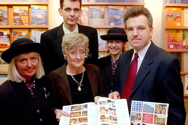 Yorkshire Evening Post break to New York winner Jennifer Riding is presented with her tickets at the Alders Travel Shop in January 2000.  She is pictured with. from left, Pat Foster, Andrew Brookes, Heather Rogers (British Airways Travel Consultants) and John Pollard (Sales Manager North America Travel Service.)