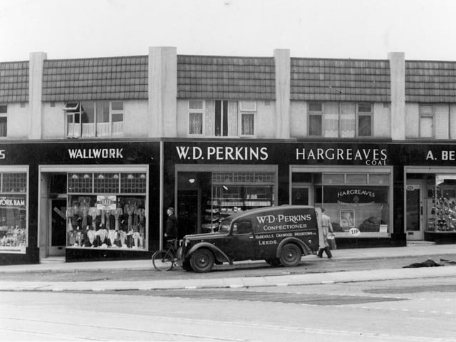 Stainbeck Corner in July 1939. Shops in focus are, on the left, Wallwork, selling clothing, then moving right, W.D. Perkins, bakers shop. A delivery van outside lists other branches at Moortown, Oakwood and Harehills. Then at number 3 is Hargreaves Coal Merchants, also agent for 'Zip' dry cleaning, partially seen to the right, number 2 A. Benton, shoe shop.