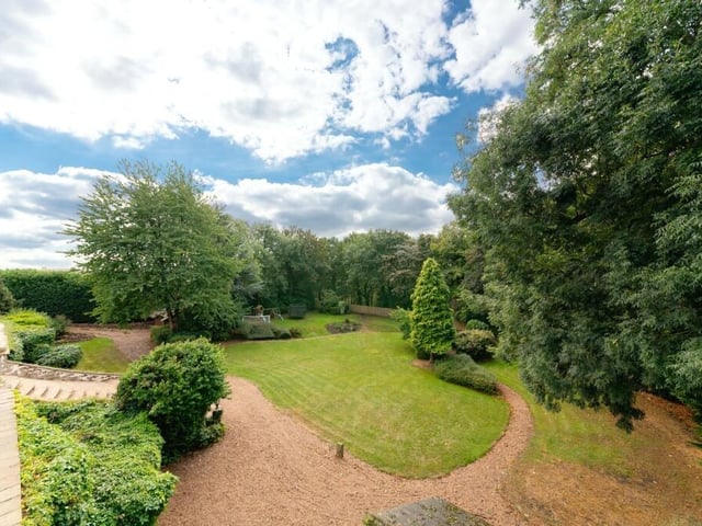 The extensive and private gardens, with adjoining woodland.
