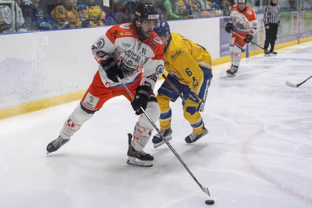 ONCE WE'RE RIVALS: Matt Bissonnette (left) battles with Leeds Knights' Ethan Hehir - the two will be team-mates in West Yorkshire next season. Picture: Tony Johnson