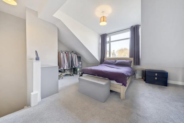 Located on the second floor there is a large double bedroom. There is a front facing dormer window and the current owner uses the alcoves to good use as storage.