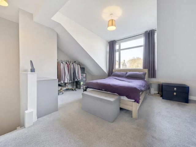 Located on the second floor there is a large double bedroom. There is a front facing dormer window and the current owner uses the alcoves to good use as storage.