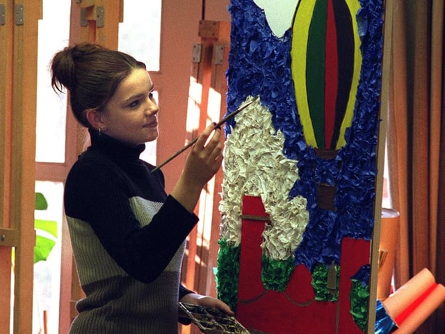 Sixth form pupil Simone Lowry works on her transport mural at Middleton Park High in December 1998.