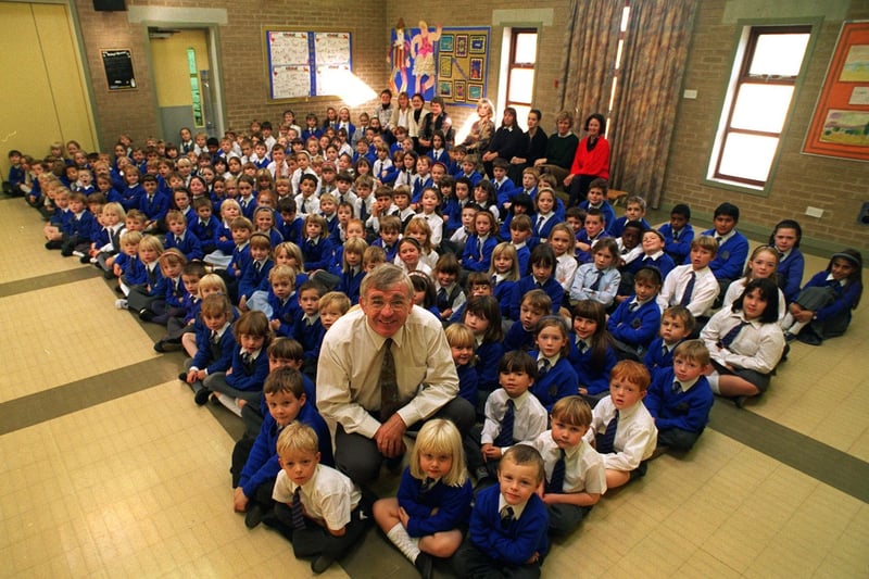 Head teacher Alan Padden pictured with pupils in the assembly hall at Adel Primary School in October 1996.