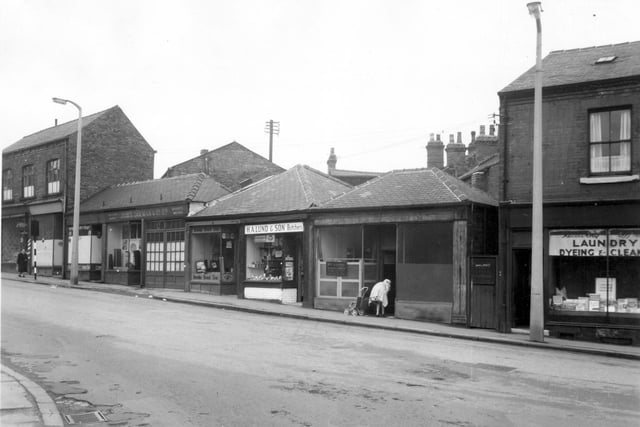 H.A. Lund butchers shop on Woodhouse Street in June 1963. Next right is a doctor's surgery, the practice of Dr. C. A. Sandle.