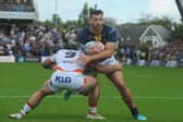 Leeds Rhinos' man of the match Jake Connor is tackled by former teammate Andy Ackers during the 42-12 win against Bradford Bulls. Picture by Steve Riding.