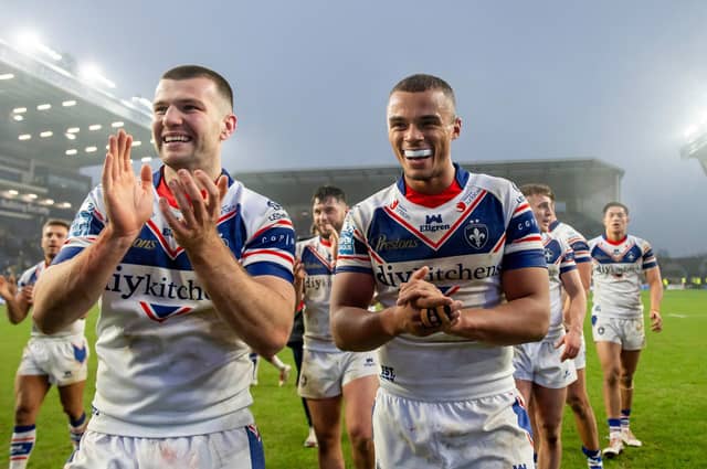 Max Jowitt and Corey Hall celebrate Wakefield Trinity's two-point victory at Leeds Rhinos in Betfred Super League round one. Picture by Allan McKenzie/SWpix.com.