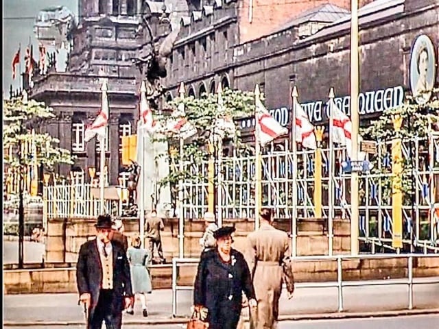 The Headrow looking from the junction with Cookridge Street, showing the Town Hall, Library and Art Gallery decorated to celebrate the coronation of Queen Elizabeth II.