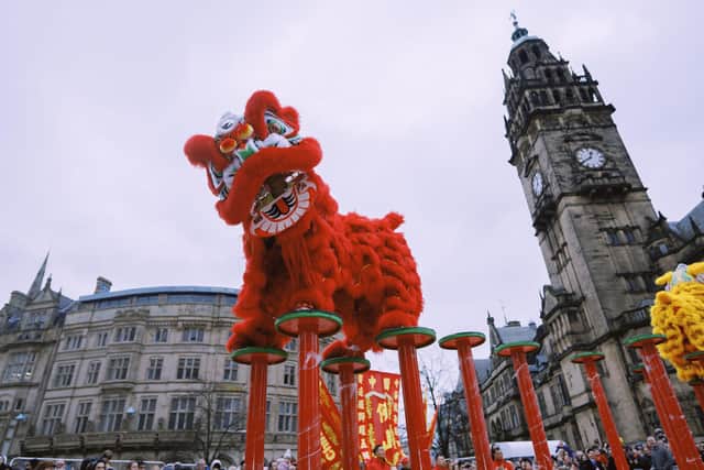 The world champion lion dancers from Foshan, China, amazed on-lookers outside the town hall