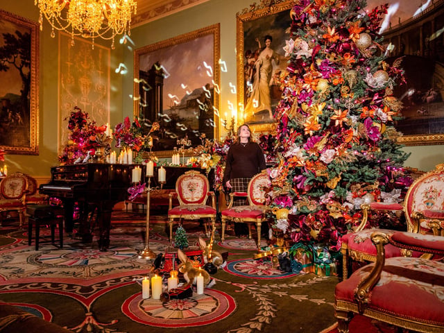 Head of Public Programme at Harewood House Trust, admiring the christmas decorations in the Music Room.