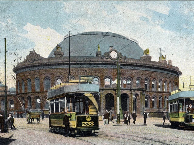 A colour-tinted postcard of the Corn Exchange with a postmark 25th November 1904. The Corn Exchange was designed by Cuthbert Brodrick and opened on 28th July 1863. Two open-top trams are seen outside, no. 233 and no. 113.