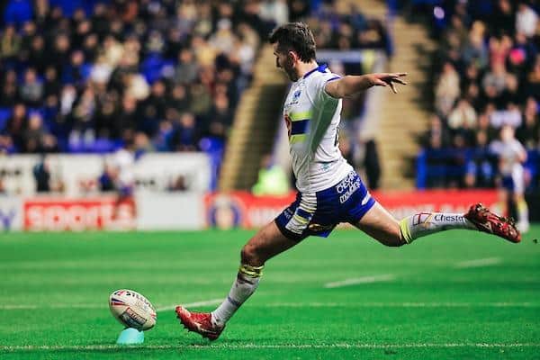 Warrington's Stefan Ratchford kicks for goal against Leeds in February. Picture by Alex Whitehead/SWpix.com.