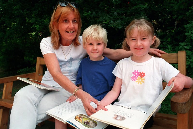 An outdoor reading lesson for Joseph Melia and Phoebe Smith with reception class teacher Gail Bickerdike at Spring Bank Primary in July 1999.