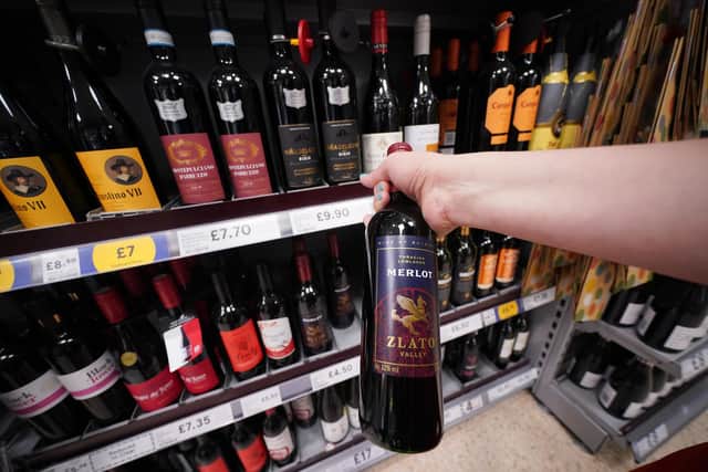 A shopper looking at wine in a Tesco supermarket. Britons will soon be able to buy "pint" sized bottles of still and sparkling wine in the form of a new 568ml amount to appear on supermarket shelves and in pubs, clubs and restaurants, the Government has announced.