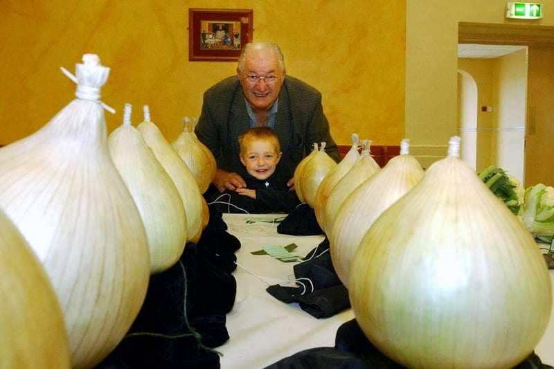 Admiring the onions at Houghton Feast Horticultural Show in 2003. Do you recognise the people in the picture?