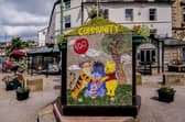 One side of the Children's well celebrates 100 years of Winnie the Pooh. Photo Roger Beverley