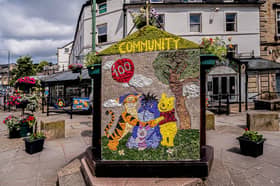 One side of the Children's well celebrates 100 years of Winnie the Pooh. Photo Roger Beverley