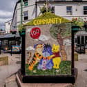 One side of the Children's well celebrates 100 years of Winnie the Pooh. Photo Roger Beverley