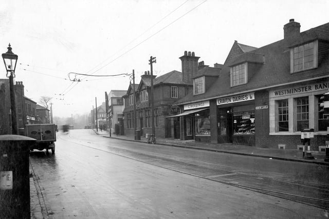 Looking towards Kirkstall Lane, on the right, junction with Otley Road is a branch of the Westminster Bank in January 1935. Moving to the left is the premises of Craven Dairies which was also a bakers. Next is C. Hollings butcher then  Leeds Rating Authority office, which also housed a caretaker.
