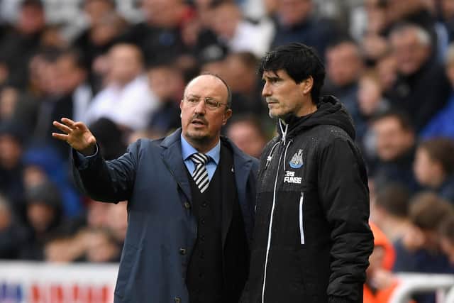 Former Newcastle manager Rafa Benitez (l) and coach Mikel Antia react during the Premier League match between Newcastle United and Stoke City in 2017 (Photo by Stu Forster/Getty Images)