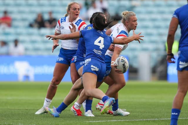 England's Georgia Roche offloads during the defeat by Samoa. Picture by David Neilson/SWpix.com.