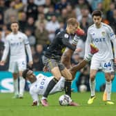 FORTUNATE: Leeds United defender Junior Firpo, pictured tumbling left behind Southampton's Flynn Downes, not to see red. Picture by Tony Johnson.
