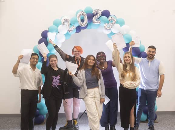 Students at Leeds City College, Park Lane in Leeds, celebrate their A Level results.