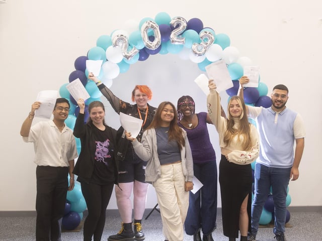 Students at Leeds City College, Park Lane in Leeds, celebrate their A Level results.