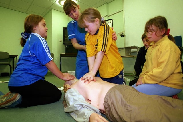 Cardiology Sister Bev Cummings helps some of the children from Windmill Primary with heart massage techniques during their visit to Pinderfields Hospital in December 1998.