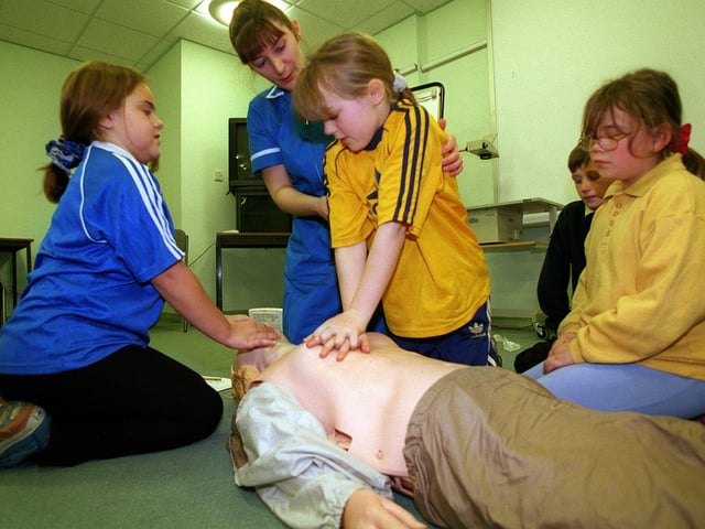 Cardiology Sister Bev Cummings helps some of the children from Windmill Primary with heart massage techniques during their visit to Pinderfields Hospital in December 1998.
