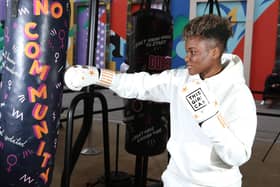 Nicola Adams punches a bag representing a key barrier that prevents women from getting active as Sport England's This Girl Can launches its latest campaign. Picture: Rachel Adams/PA Wire