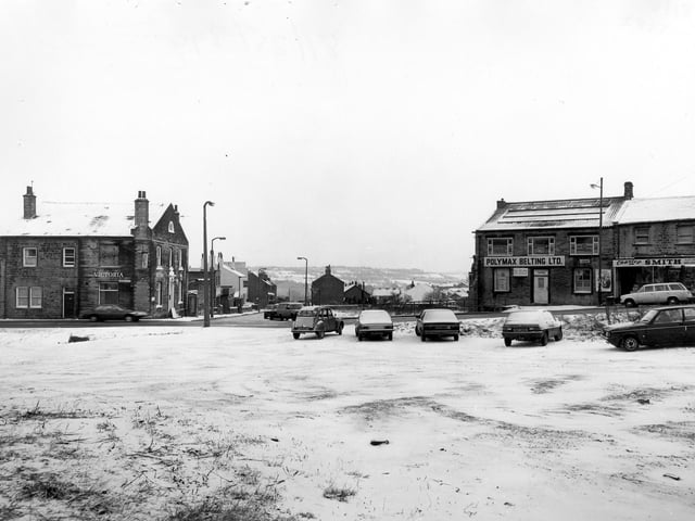 Lowtown at the junction with Hough Side Road in January 1982. On the left is the Victoria Hotel. To the right are Polymax Belting Ltd. and Charles Smith, greengrocer.