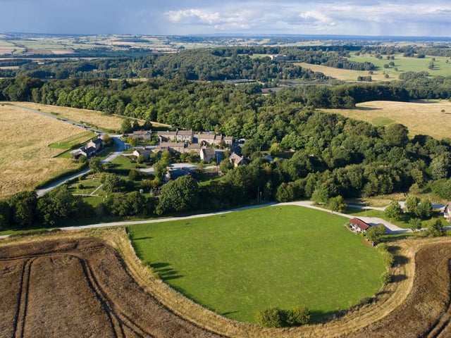 The Emmerdale village covers more than 11 acres of land in the Yorkshire Dales, with all its buildings classed as temporary structures and most built using timber structures covered in limestone cladding, designed to emulate 1600s housing designs built with Yorkshire limestone. Pic: Rotor Aerial Photography/ITV Studios/PA Wire