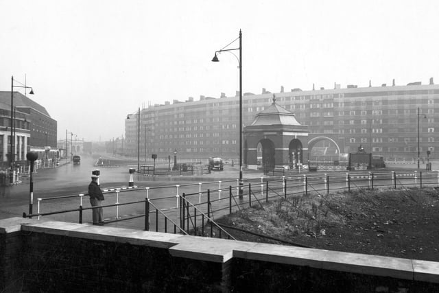A view looking north east across the roundabout at the junction of Eastgate and St Peter's Street in July 1943. Quarry Hill Flats are behind. Appleyard's petrol station is on the roundabout. A man looks at the camera.