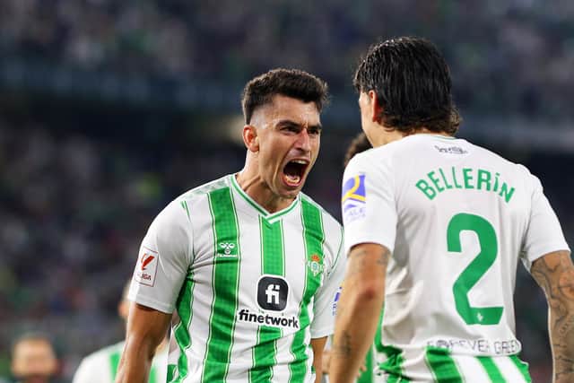 SEVILLE, SPAIN - OCTOBER 01: Marc Roca of Real Betis celebrates with teammate Hector Bellerin after scoring the team's second goal during the LaLiga EA Sports match between Real Betis and Valencia CF at Estadio Benito Villamarin on October 01, 2023 in Seville, Spain. (Photo by Fran Santiago/Getty Images)