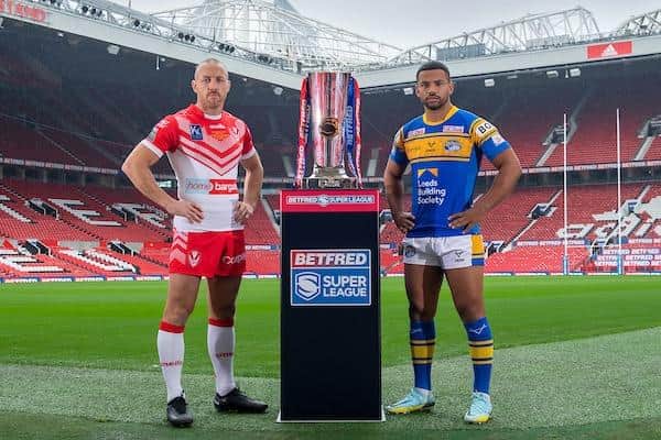 Rhinos captain Kruise Leeming and James Roby, of Saints, with the Super League trophy at Old Trafford. Picture by Allan McKenzie/SWpix.com.