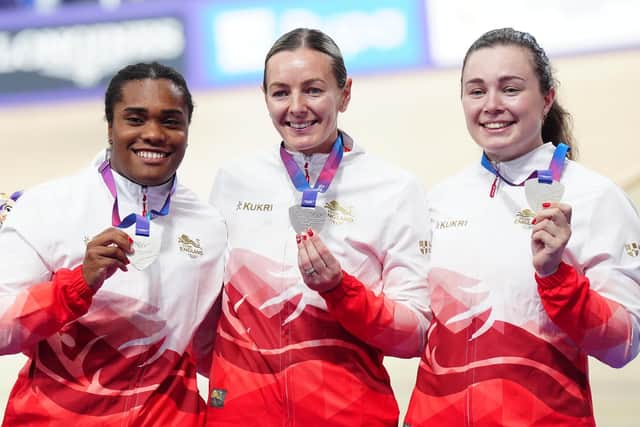 SILVER LINING: Katy Marchant (centre) shows off her silver medal alongside England team-mates Rhianna Parris-Smith (left) and Sophie Capewell, for the women's team sprint at the Sir Chris Hoy Velodrome in Glasgow on Thursday. Picture: Jane Barlow/PA