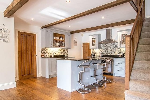 The kitchen has granite work surfaces and a number of integrated appliances.