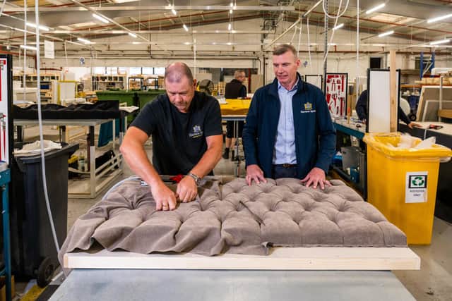 Chris pictured with Tony Foster, who works in headboard divan upholstery, who have both been at the company for more than 20 years (Photo by James Hardisty/National World)