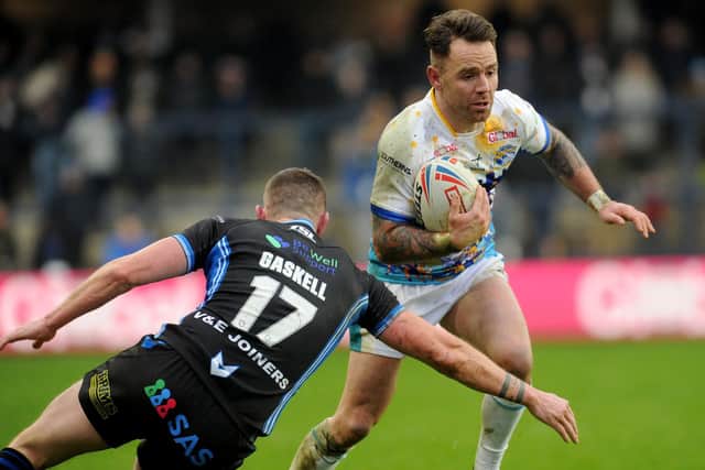 Rhinos' Richie Myler takes on Lee Gaskell, of Trinity, on Boxing Day 2021. Picture by Steve Riding.
