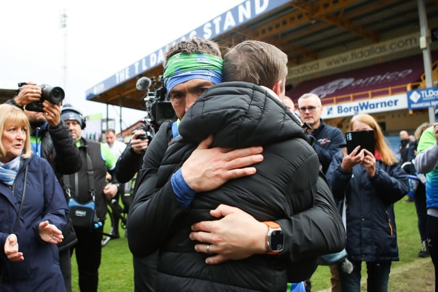Kevin Sinfield pictured hugging MND sufferer Stephen Darby in Bradford on day six of the Ultra 7 in 7 Challenge from to York to Bradford.