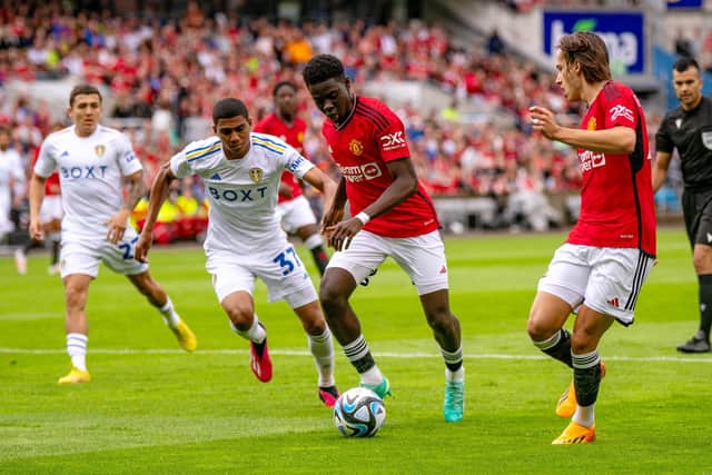 SOLID RETURN: Leeds United defender Cody Drameh, centre, challenges Manchester United's Omari Forson during Wednesday's pre-season friendly in Oslo. 
Photo by Ash Donelon/Manchester United via Getty Images.