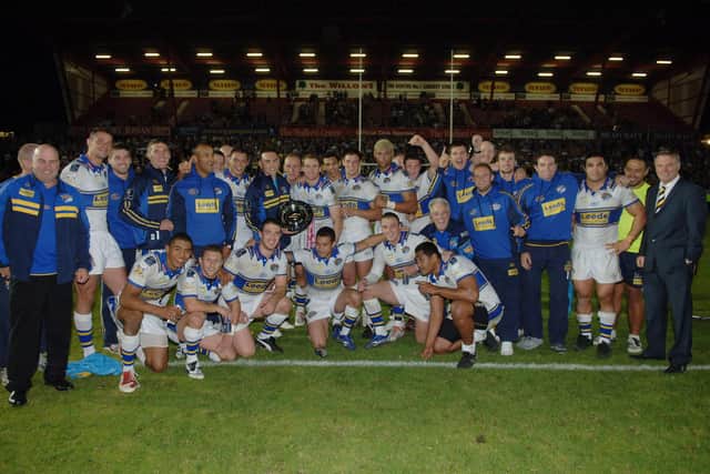 Kevin Sinfield, centre with shield, captained Rhinos to top spot in Super League 2009, among many other honours.
