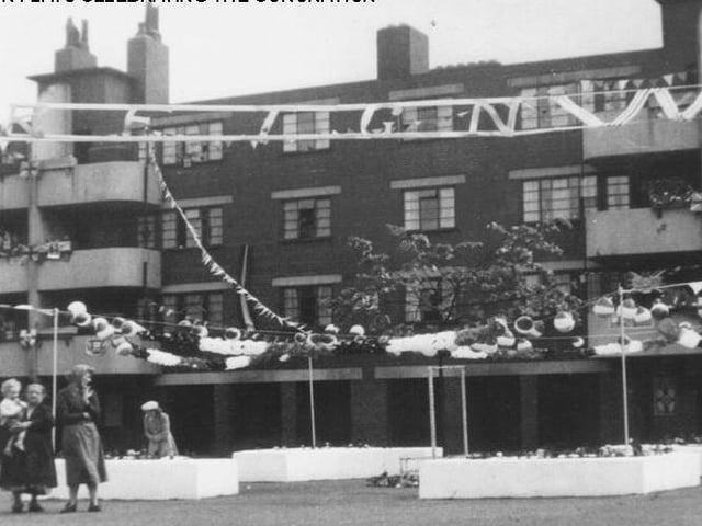 Flats at Cavalier House, between East Street and Bow Street, decorated for the coronation. The flats were demolished after 1993 during road upgrading work on East street, but to keep the community that lived there together, the residents were re-housed in 36 new flats built less than a mile away on Easy Road.