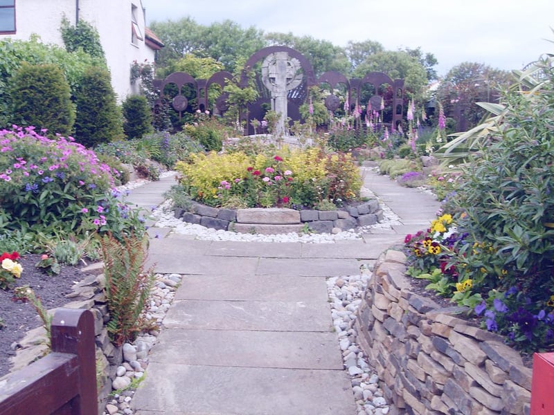 The Lindisfarne Gospels Garden is located opposite the Lindisfarne Heritage Centre on Holy Island. Inspired by the Lindisfarne Gospels, it was originally designed by Stan Timmins for the Chelsea Flower Show in 2003, where it won a silver medal. The garden was recreated on Lindisfarne, where it was officially opened by Lady Rose in September 2004.